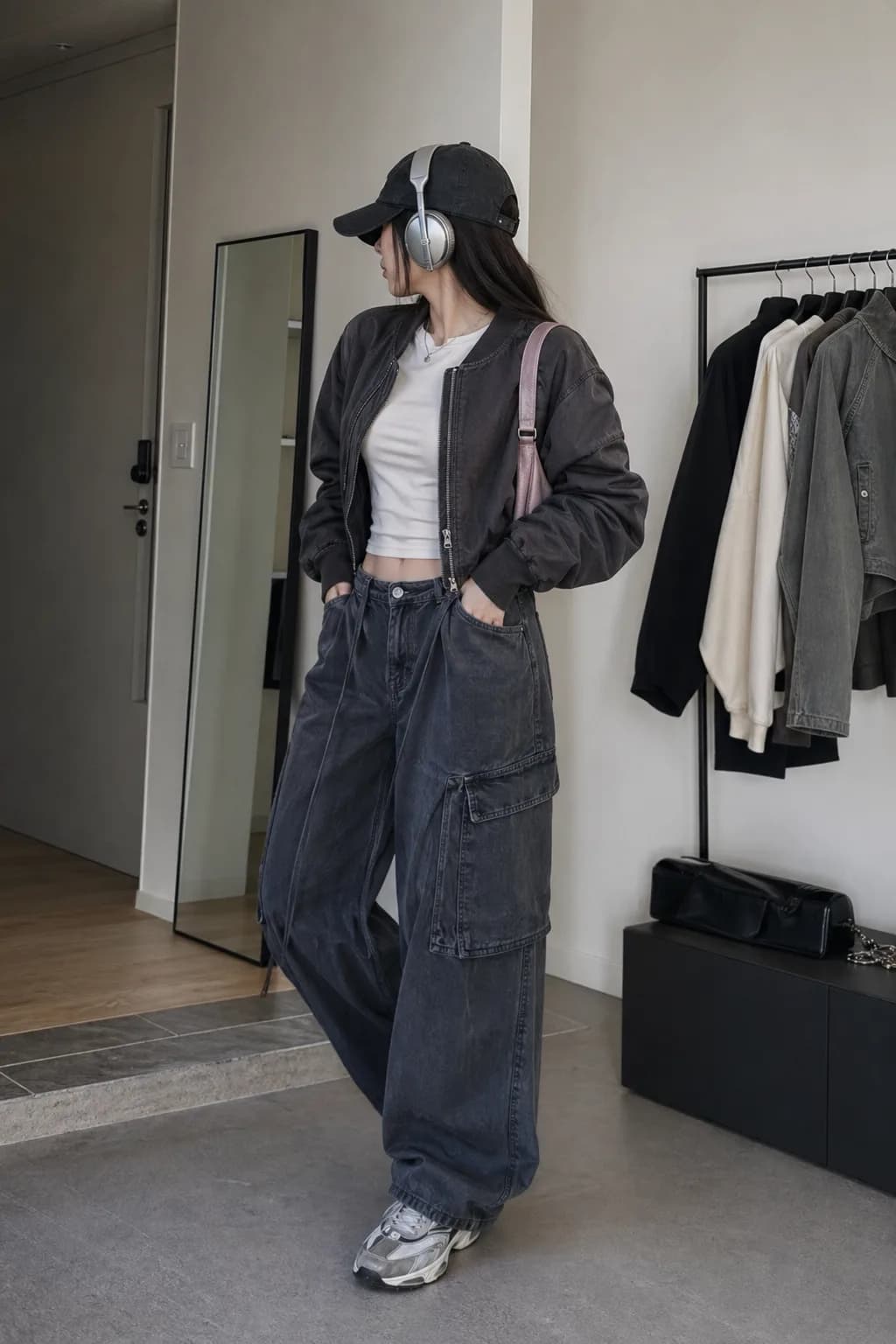 K-pop off-duty outfit with an oversized jacket, baggy denim, headphones, and a cap